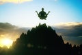 Man meditating on mountain top Royalty Free Stock Photo