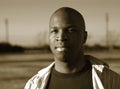 Man meditating; in sepia