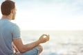 Man in meditation near the sea Royalty Free Stock Photo