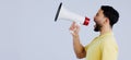 Man, megaphone and studio profile in space, mockup and shout for rally, promo or announcement by background. Speaker