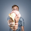Man with a melting ice cream cone in his hand Royalty Free Stock Photo