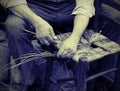 man mender of chairs while repairing old wooden chair with vintage effect