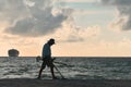 A man with metal detector at Miami Beach