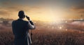 man with a microphone at a large outdoor event Royalty Free Stock Photo