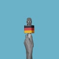 man with a microphone patterned with the german flag Royalty Free Stock Photo