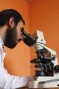 Man and microscope Royalty Free Stock Photo