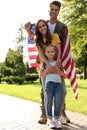 Man in military uniform with American flag and his family Royalty Free Stock Photo