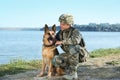 Man in military uniform with German shepherd dog Royalty Free Stock Photo