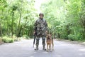 Man in military uniform with German shepherd dog Royalty Free Stock Photo