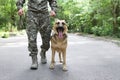 Man in military uniform with German shepherd dog Royalty Free Stock Photo