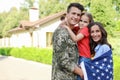 Man in military uniform and his family with American flag Royalty Free Stock Photo