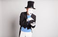Man Mime Holding Cell Phone. April Fool's Day Concept.