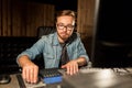 Man at mixing console in music recording studio Royalty Free Stock Photo