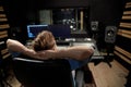 Man at mixing console in music recording studio