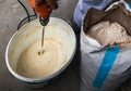 Man mixing mass for plaster works