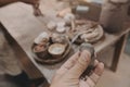 Man molding clay to make ceramics with his hands, Artisan working in his workshop, Selective Focus Royalty Free Stock Photo