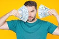 Man with money cash. Dollar banknotes. Portrait of man holding bunch of money banknotes. Dollar bills, credit, online