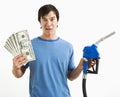 Man with money and gas nozzle. Royalty Free Stock Photo