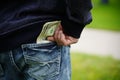 Man with money in pocket of jeans. dollars in pocket of jeans. Royalty Free Stock Photo