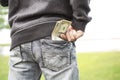 Man with money in pocket of jeans. dollars in pocket Royalty Free Stock Photo