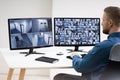 Man Monitoring CCTV Footage Royalty Free Stock Photo