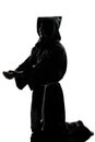Man monk priest silhouette praying Royalty Free Stock Photo