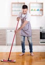 Man mopping floor Royalty Free Stock Photo