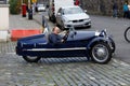 Man in a Morgan Three-Wheeler