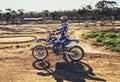 Man, motorbike and outdoor on trail for portrait with helmet on dirt, path and countryside in summer. Person, motorcycle Royalty Free Stock Photo