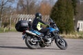 Man on a motorbike on the road riding. having fun driving the empty road on a motorcycle tour journey