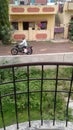 A man on motorcycle with consumables on bags