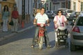 Man on motorcycle and woman with baby in village in Southern Spain off highway A49 west of Sevilla