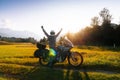 Man motorcyclist happy destination scene. Motorcycle adventure. Alpine mountains on background. Biker lifestyle, world traveler.