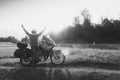 Man motorcyclist happy destination scene. Motorcycle adventure. Alpine mountains on background. Biker lifestyle, world traveler.