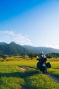 Man motorcyclist ride touring motorcycle. Alpine mountains on background. Biker lifestyle, world traveler. Summer sunny sunset day