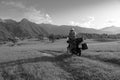 Man motorcyclist ride touring motorcycle. Alpine mountains on background. Biker lifestyle, world traveler. Summer sunny sunset day