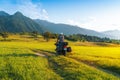 Man motorcyclist ride touring motorcycle. Alpine mountains on background. Biker lifestyle, world traveler. Summer sunny sunset day