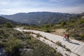 Man with mountain bike on a concrete country road. Royalty Free Stock Photo