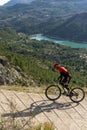 Man with mountain bike on a concrete country road. Royalty Free Stock Photo