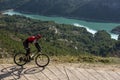 Man with mountain bike on a concrete country road. Royalty Free Stock Photo