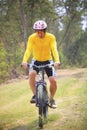 man and mountain bike riding in jungle track use for bicycle sport outdoor and extreme activities Royalty Free Stock Photo