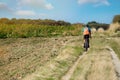 man mountain biking in the country lanes between Calais and Boulogne-sur-mer at sunset in autumn