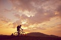 Man mountain biking sunny side view Royalty Free Stock Photo