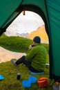 A man in mountain day summer. View from tent Royalty Free Stock Photo