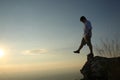 a man on a mountain top. Person on the rock. Sport and active life concept. Beauty world Royalty Free Stock Photo