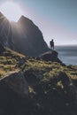 Man mountaineer standing on rock of peak mountain at sunset. Ryten Mountain, Norway Royalty Free Stock Photo