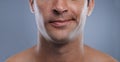 Man, mouth and smirk with face and lips for hygiene, jawline, and unhappy for treatment closeup. Grooming, mockup space Royalty Free Stock Photo