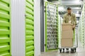 Man Moving Boxes in Self Storage Unit Royalty Free Stock Photo