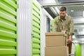 Man Moving Boxes in Storage Warehouse Royalty Free Stock Photo