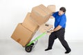 Man moving boxs with a hand truck. Royalty Free Stock Photo